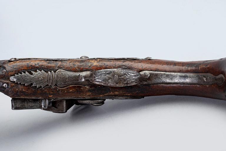 An 18th Century flinlock pistol.