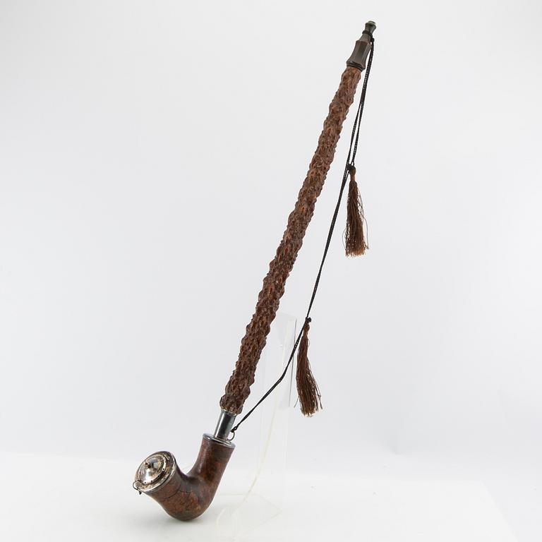 Long pipe  Carved wood with a silver mount Hasa Malmö 1986.