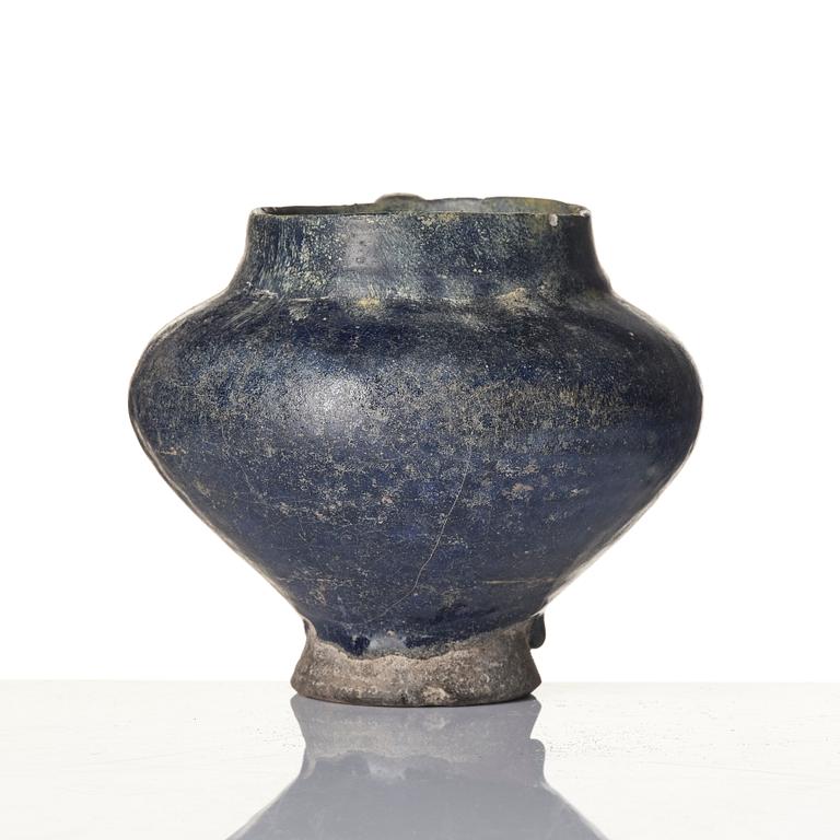 A blue-glazed Nishapur pottery Jug, Persia, 13th century.