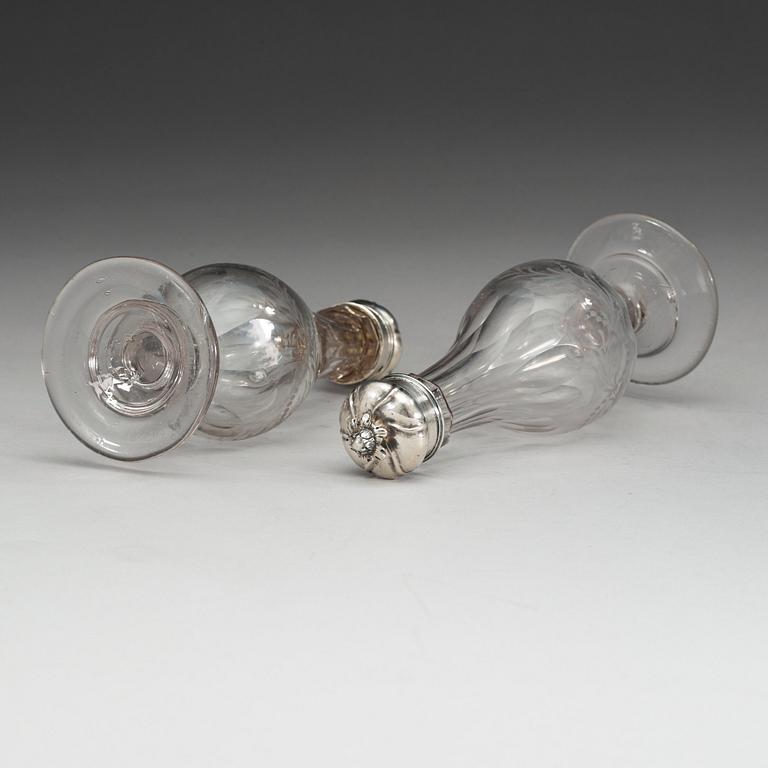 A pair of Swedish 18th century glas-bottles and silver-covers, marks of Arvid Floberg, Stockholm 1766.