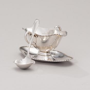 A sauce boat with a sauce ladle in silver, mark of Paul Bang, Copenhagen, Denmark 1929 and 1930s.