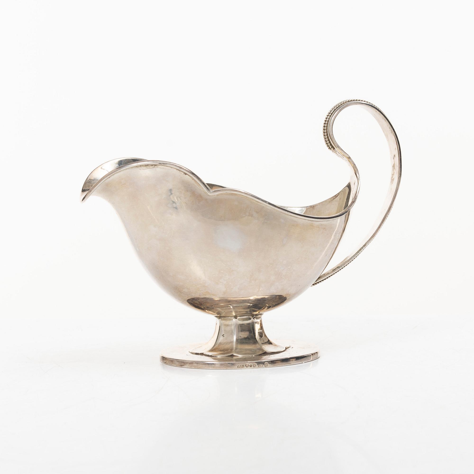 Sauceboat and four punch cups, silver, Sweden, 20th century.
