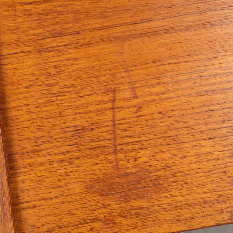 A pair of teak bedside tables, second half of the 20th Century.