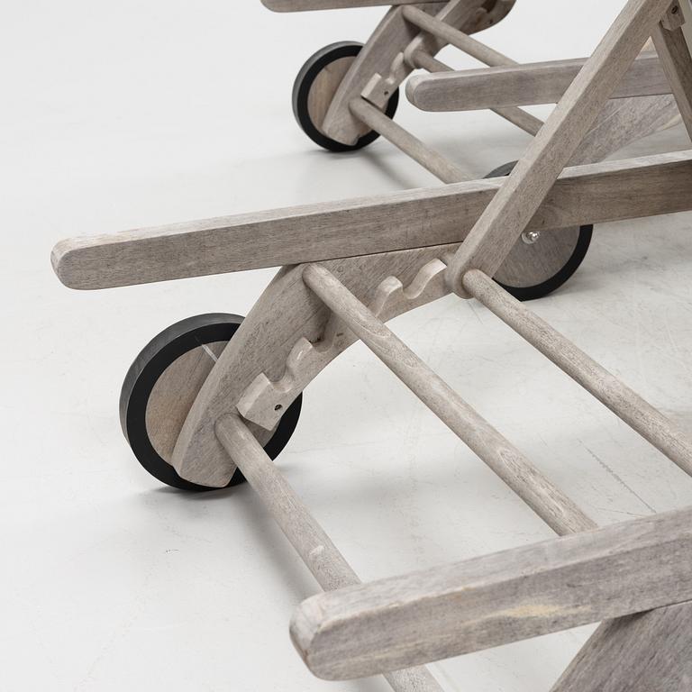 A pair of 'Columbus Sunbed' teak deck chairs, Skagerak, Denmark.