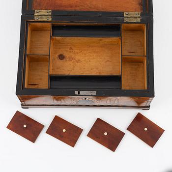 A mahogany-veneered box, first half of the 19th century.