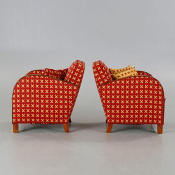 A pair of 1930s armchairs.