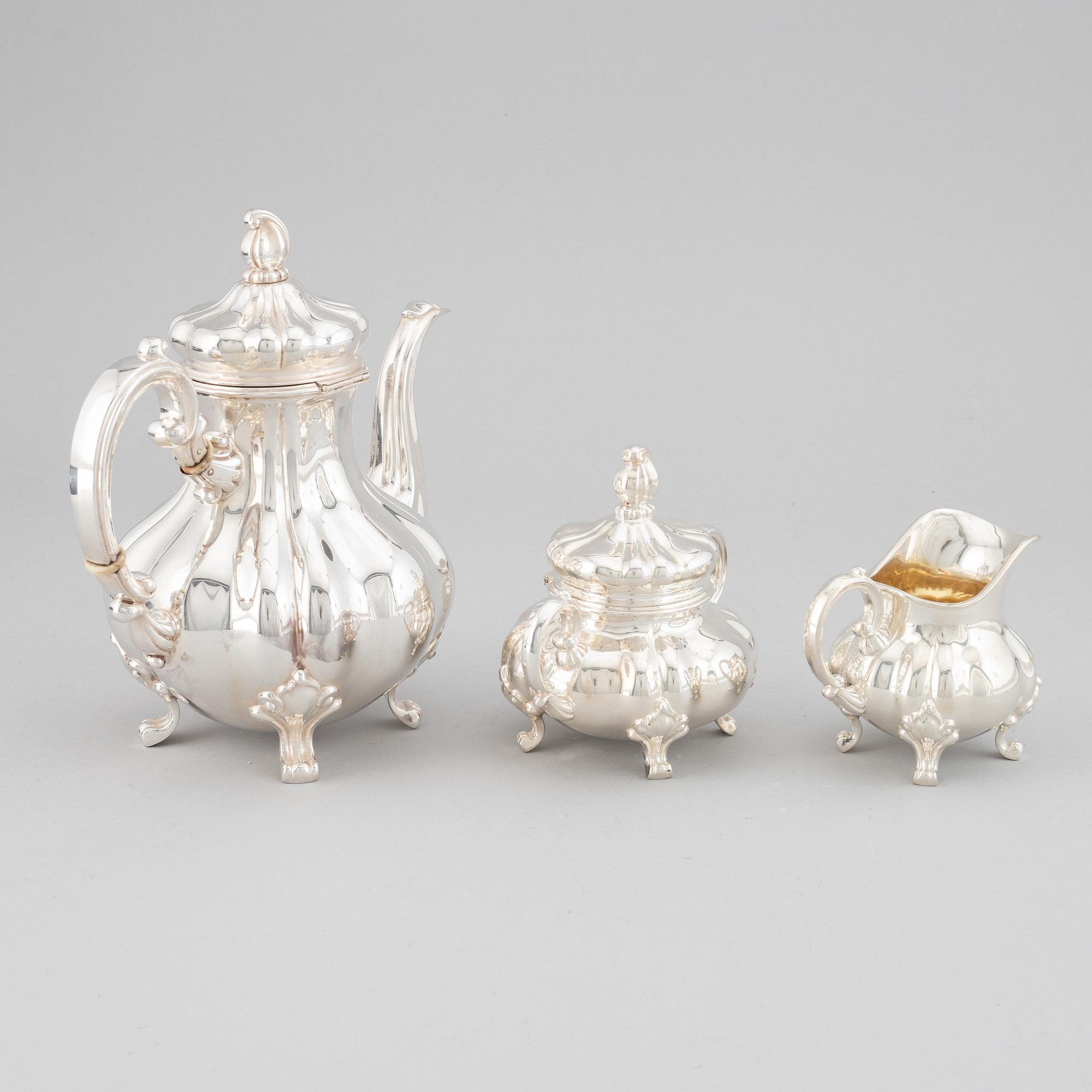 A 20th century silver coffee pot, creamer and sugar bowl. Swedish import mark.
