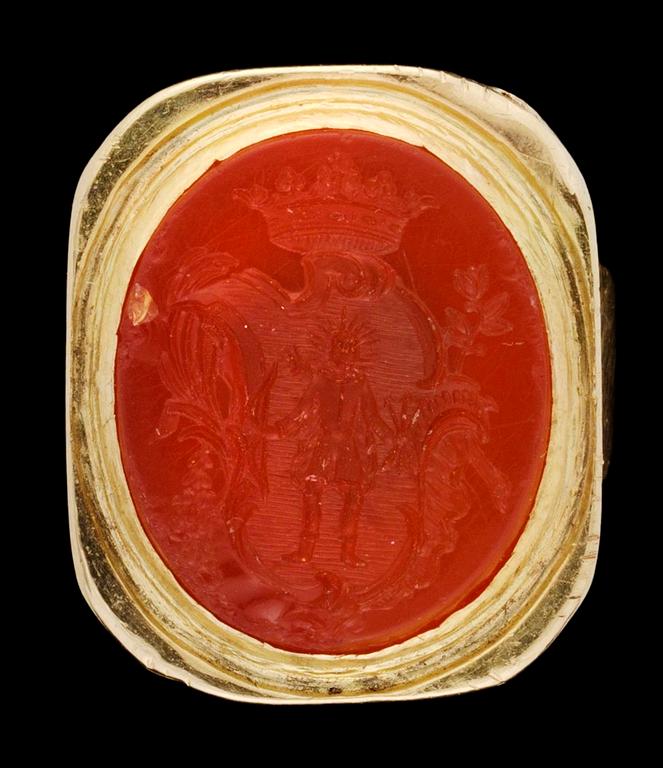 A gold heraldic ring.