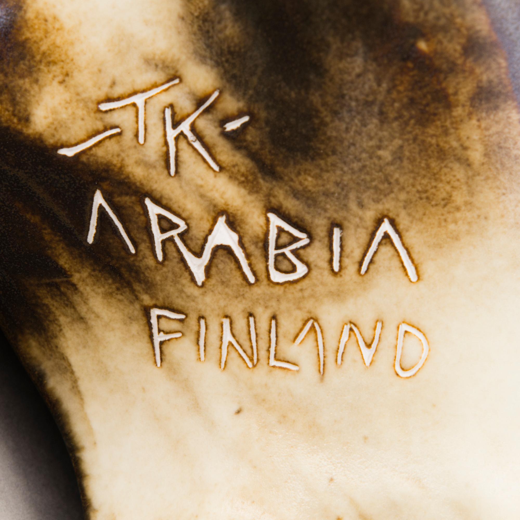 A Ceramic Figurine, signed T Kaasinen Arabia Finland.