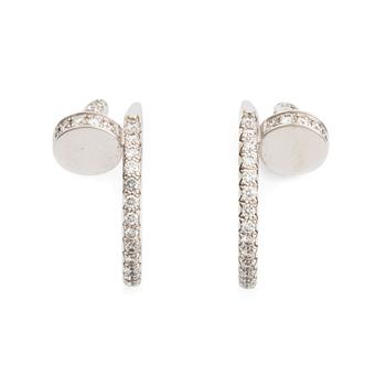 458. Cartier "Juste un Clou" a pair of earrings in 18K white gold with round brilliant-cut diamonds.