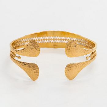 Tapio Wirkkala, rannekoru, "Viikinkiranne", 18K kultaa, 1960-luku.