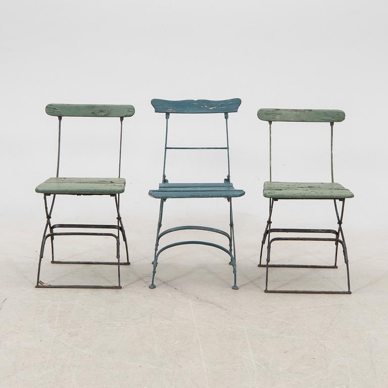 A set of three garden chairs and one cast iron and marble table first half of the 20th century.