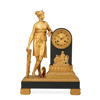583. A French Empire early 19th century mantel clock.