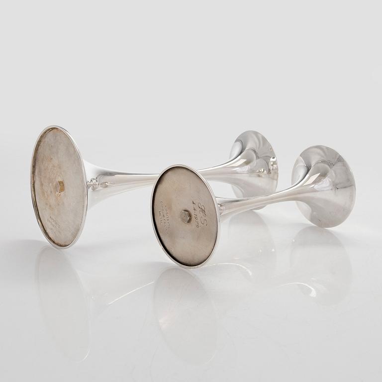 Tapio Wirkkala, A set of four silver candlesticks, "Trumpetti", Kultakeskus, Hämeenlinna 1979 and 1990.