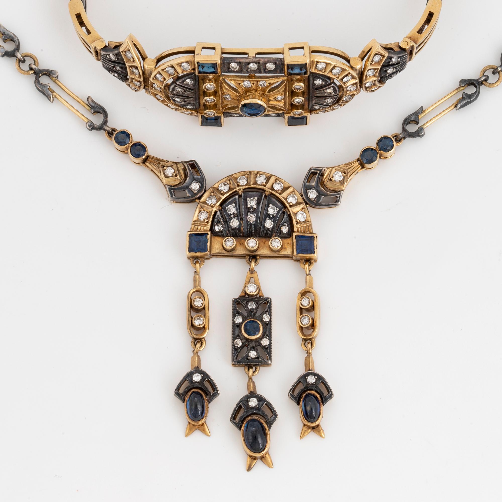 An 18K gold and silver necklace and a bracelet set with diamonds and sapphires.