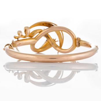 Armring i form av en orm 14K guld med en rosenslipad diamant, pärlor, cabochonslipad rubin och en röd sten.