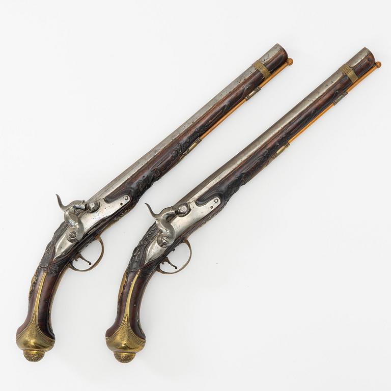 A pair of percussion pistols, converted from flintlock. 18th century.