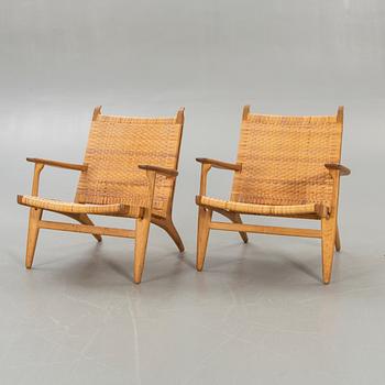 Hans J Wegner, a set of two CH27 oak and rattan armchairs.