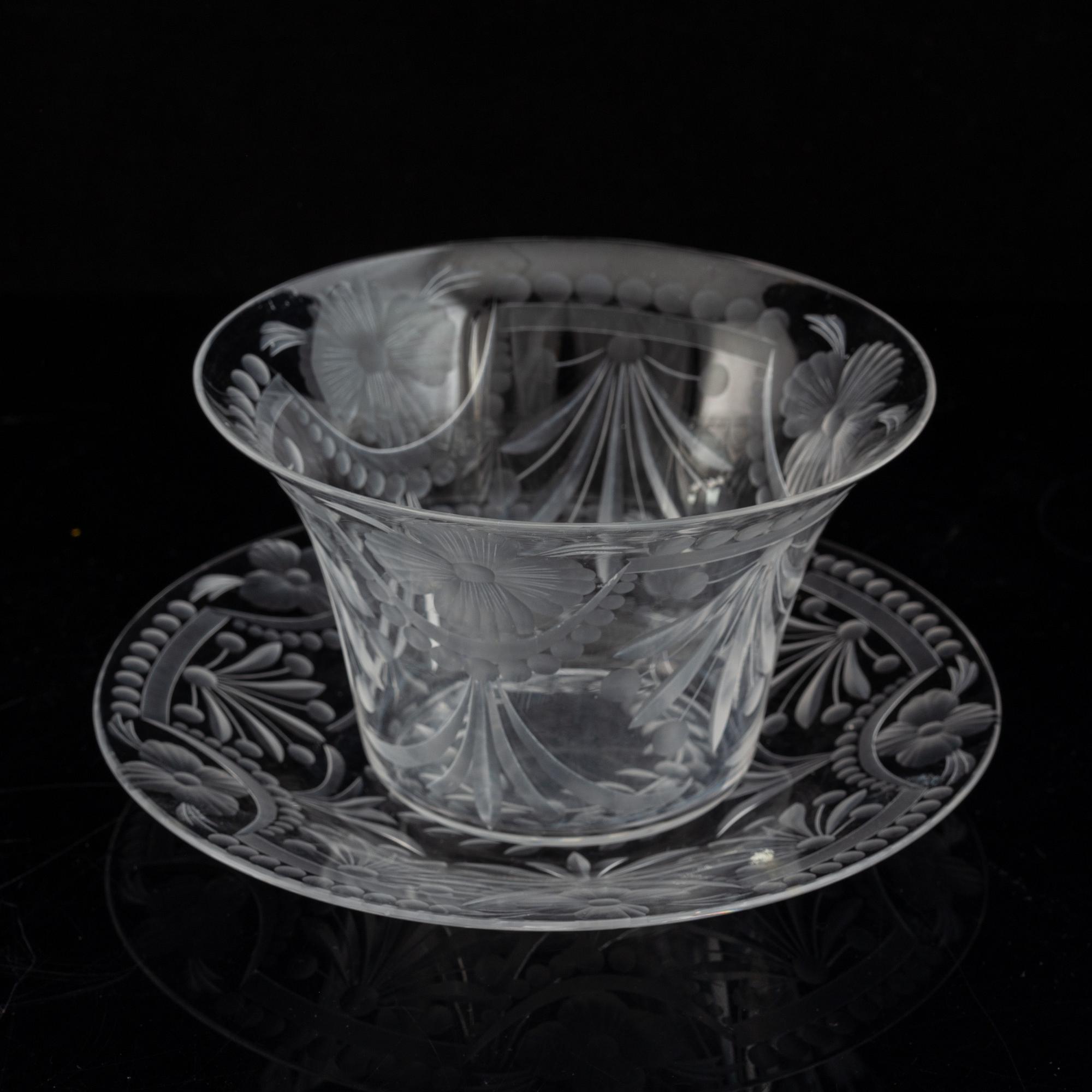 A pair of glass bowls with dishes, 20th century.