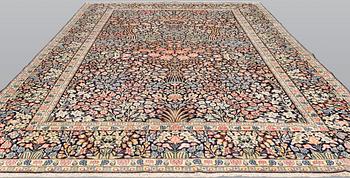 A 'Millefleur' Kerman Laver carpet, c. 410 x 290 cm.