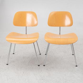 Charles & Ray Eames, a set of four 'DCM' chairs, Vitra, dated 2002.