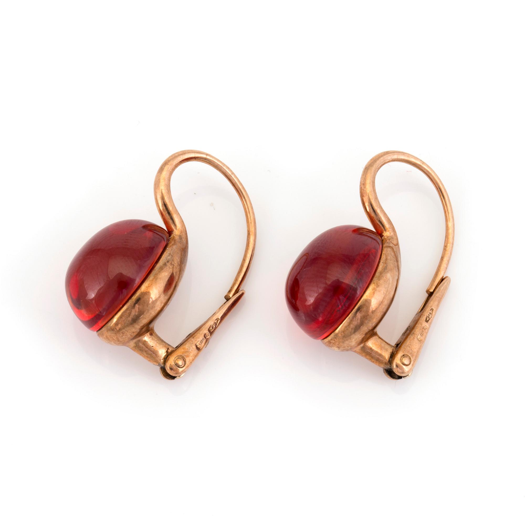 A pair of Rouge Passion earrings by Pomellato set with cabochon cut synthetic orange sapphires. Bukowskis