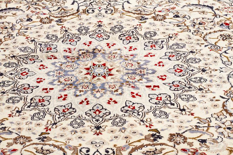 A CARPET, Nain, part silk, around 340 x 241 cm.