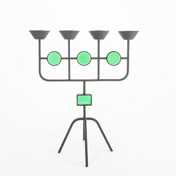 A set of three metal and glass fire place utensils and a candlestick by Gunnar Ander, second half of the 20th century.