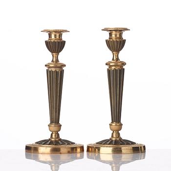 A pair of French Empire early 19th century candlesticks.