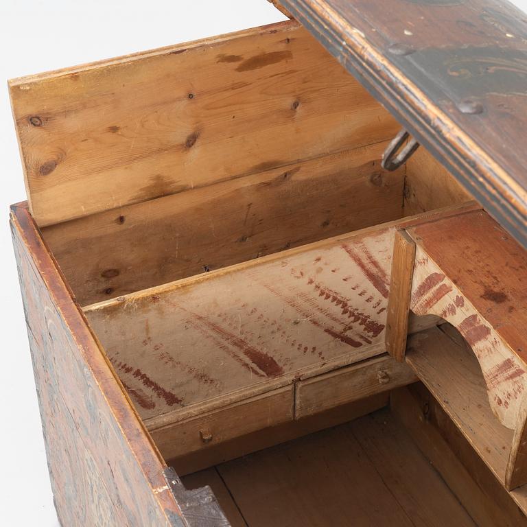 A wooden Dalecarlian chest, Sweden, dated 1820.