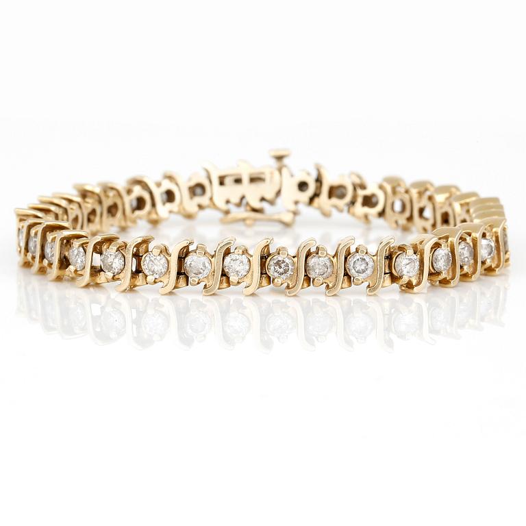 ARMBAND, med briljantslipade diamanter, totalt ca 3,50ct. 14K guld.