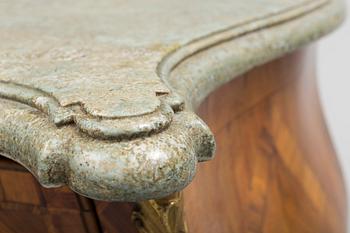 A 1700s rococo commode.