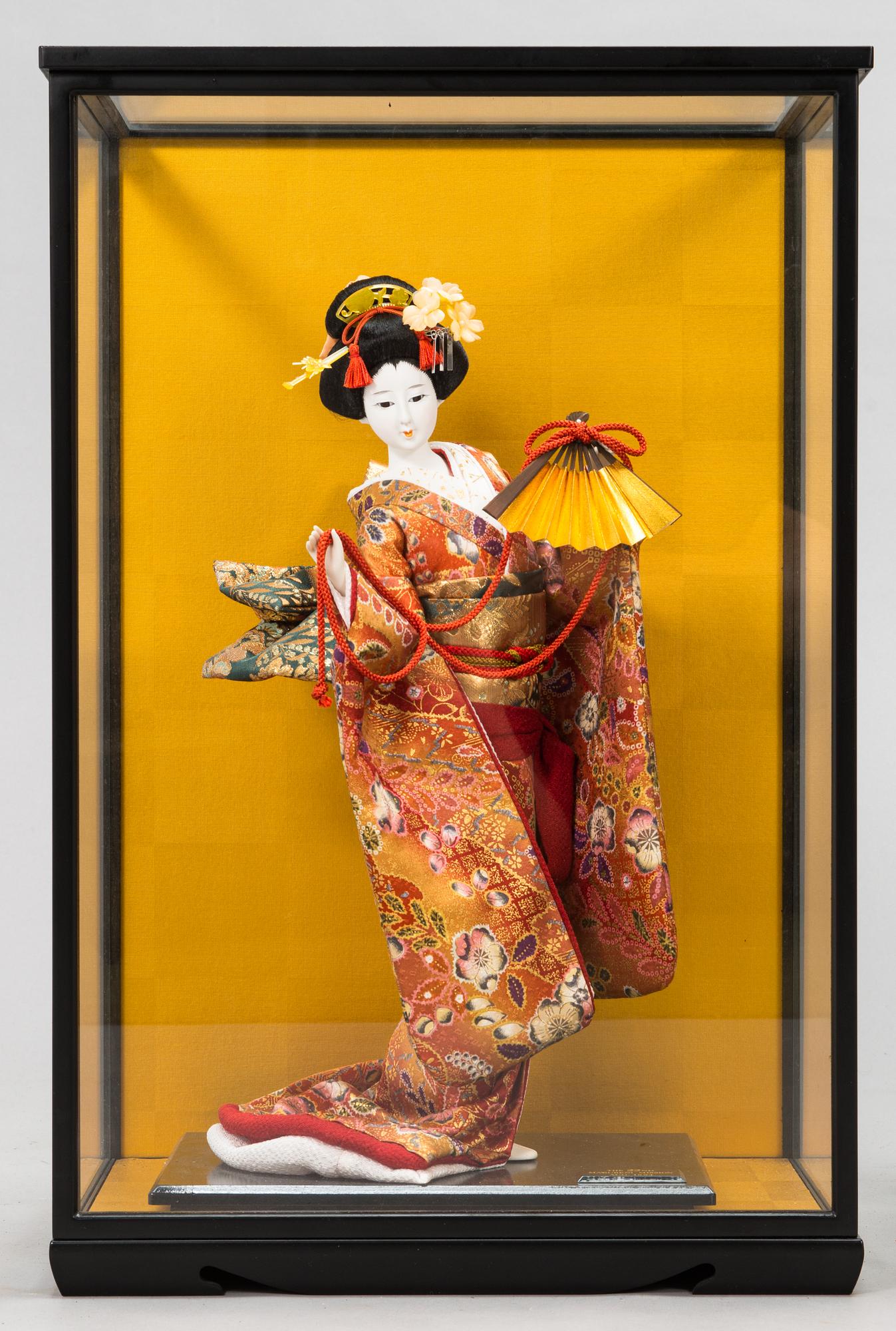 Four late 20th century Japanese dolls.