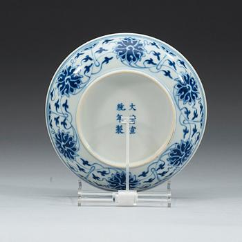 A blue and white lotus dish, Qing dynasty, Xuantong mark and of period (1909-1912).