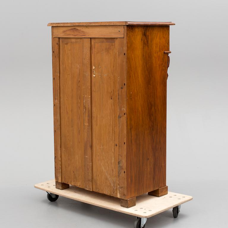 A late 19th century walnut veneered chest of drawers.