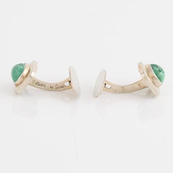 18K white gold and cabochon cut emerald cufflinks.