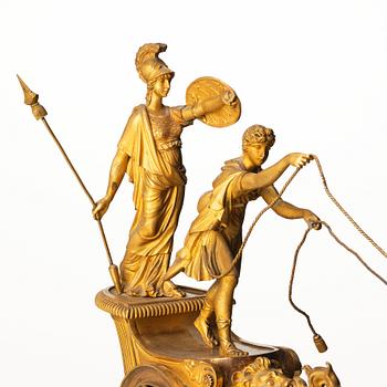 A French Empire early 19th century gilt bronze mantel clock, marked J Langlois à Paris.