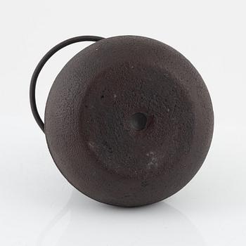 A Japanese iron vessel with cover, Meiji period (1868-1912).