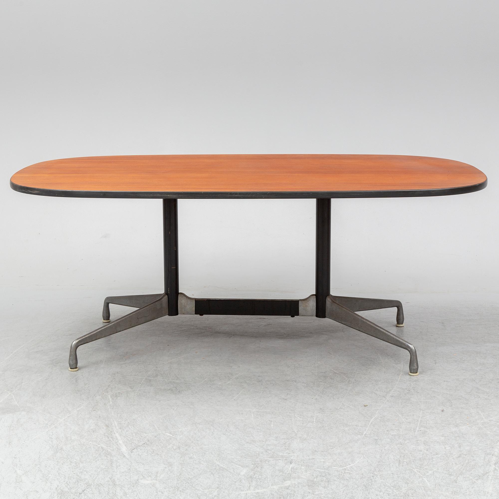CHARLES AND RAY EAMES, a mahogany veneered table, Herman Miller.