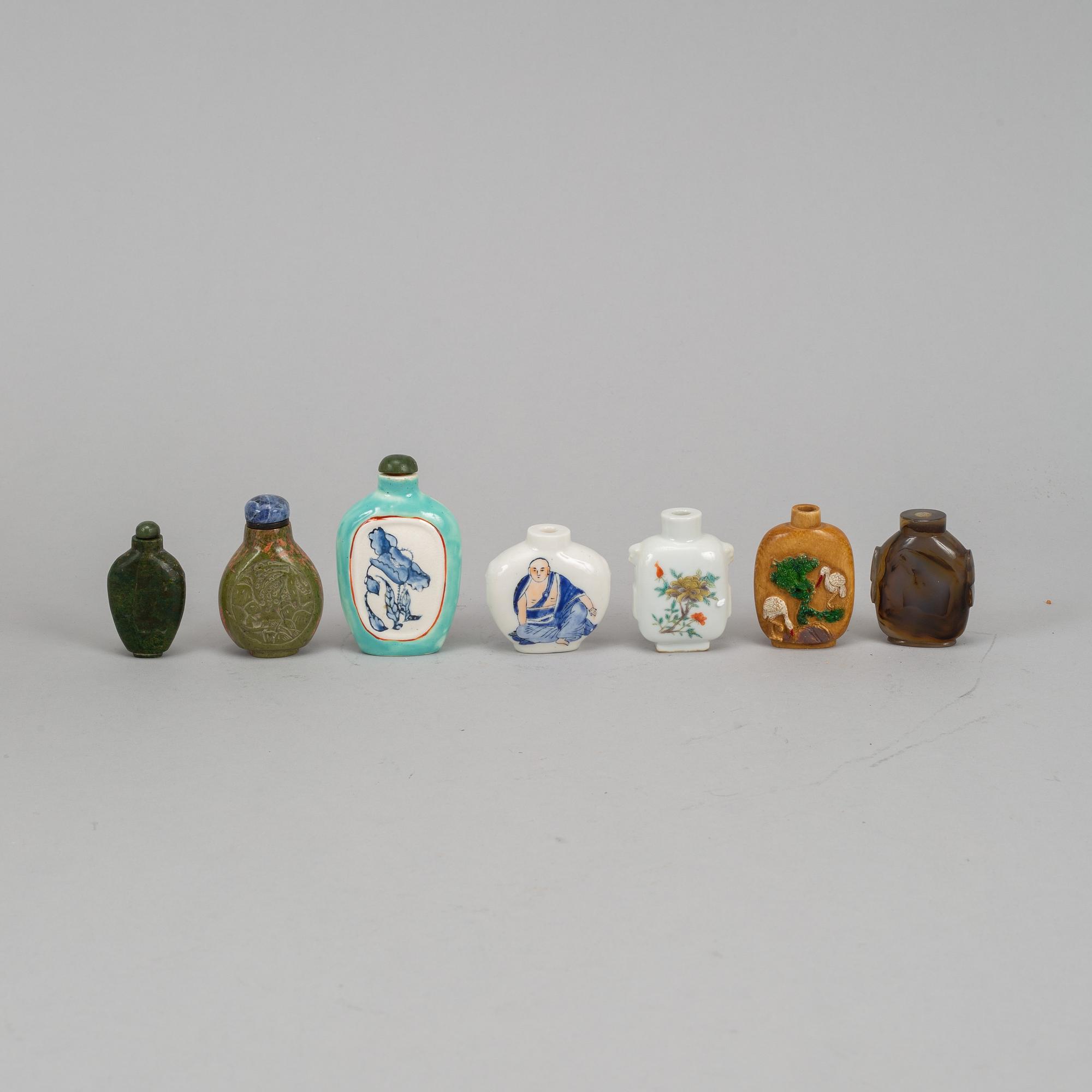 A group of seven stone, ceramic and porcelain snuff bottles, Qing dynasty and China, 19th-20th century.