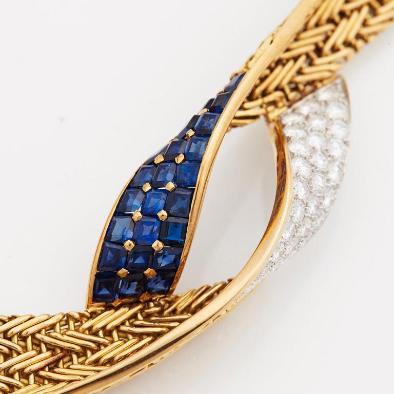 A necklace set with round- brilliant cut diamonds and step cut sapphires.