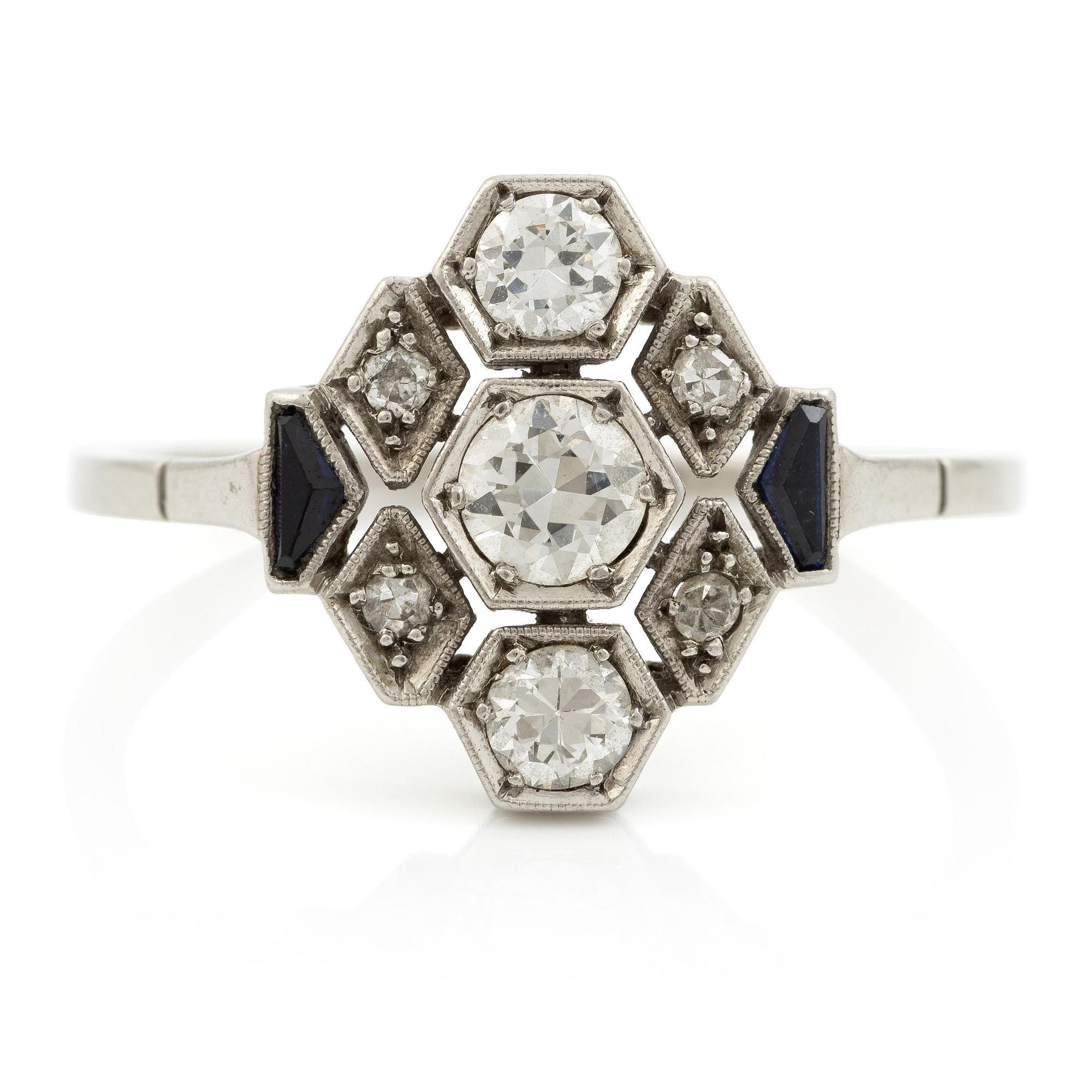 A platinum ring set with round brilliant-cut diamonds and sapphires, Art Déco.