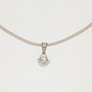 A platinum and 14K white gold pendant set with an old-cut diamond weight ca 3.00 cts quality ca K/L vs.