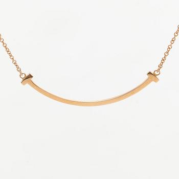 Tiffany & Co, an 18K gold 'T Smile' necklace.