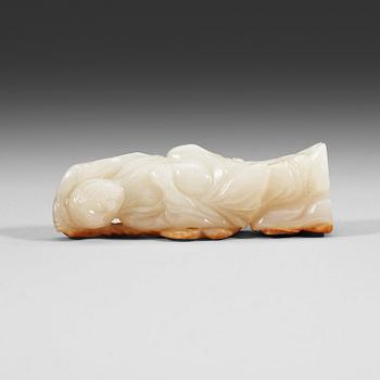 A carved nephrite figurine, presumably late Qing dynasty (1644-1912).