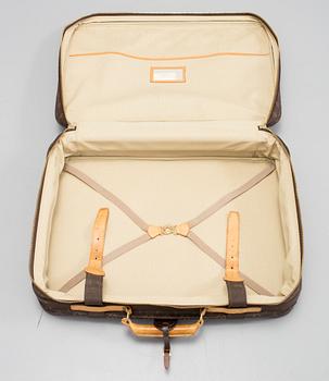 LOUIS VUITTON, a mongram canvas suitcase.