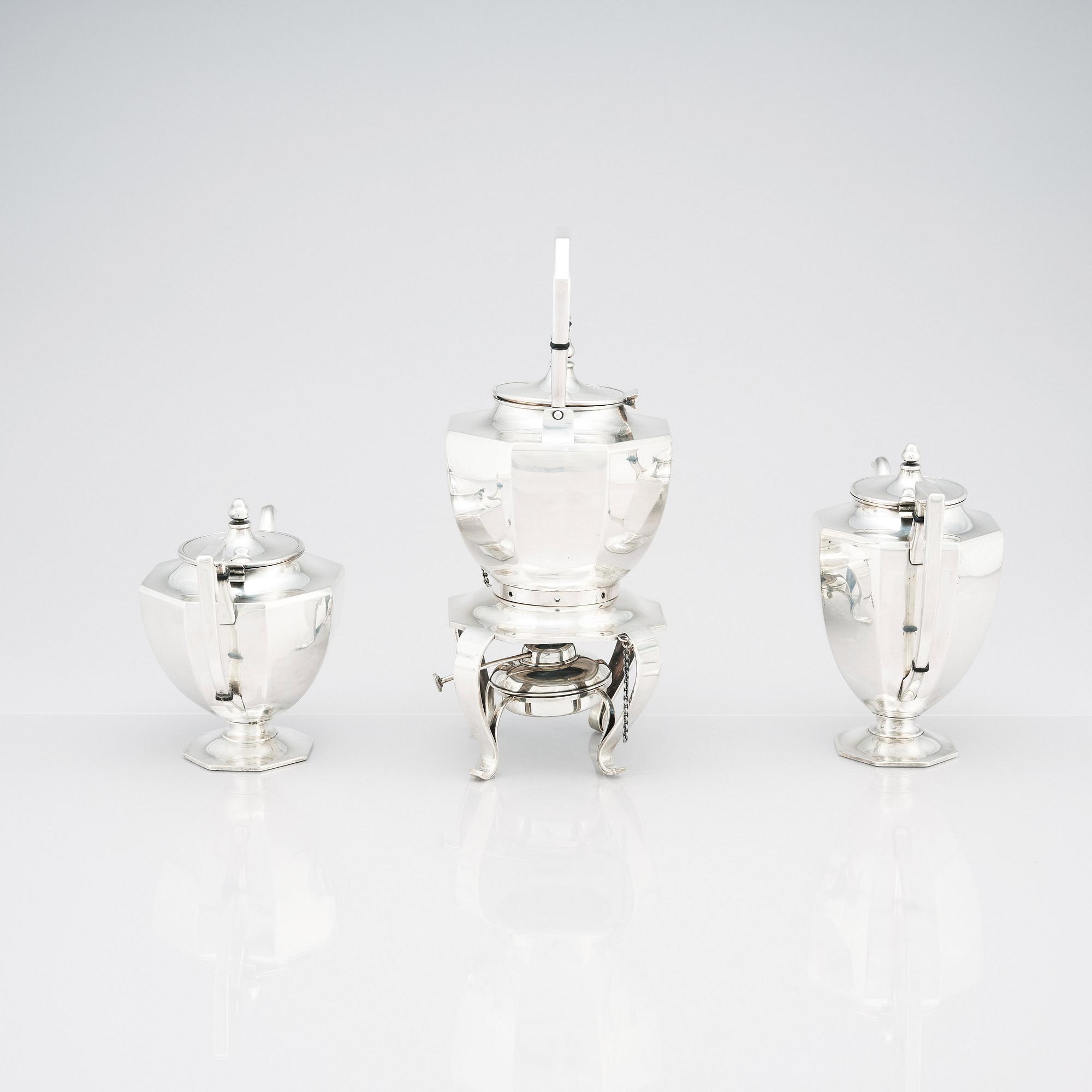 A box with a Japanese silver tea and coffee service by A box with a Japanese silver tea and coffee service by