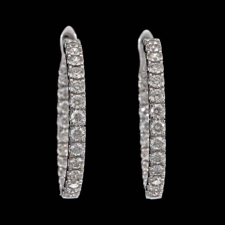 A pair of brilliant cut diamond earrings, tot. 3.88 cts.