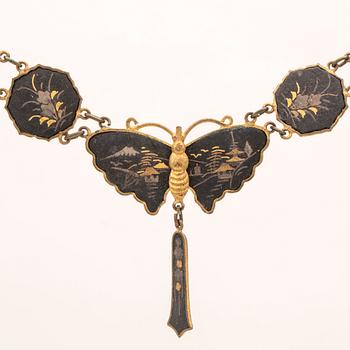 A silver-plated, gilded and lacquered metal parure from Japan, first half of the 20th century.