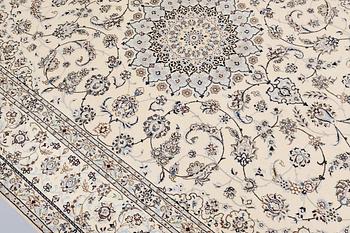 A Nain, part silk carpet, 305 x 207 cm.